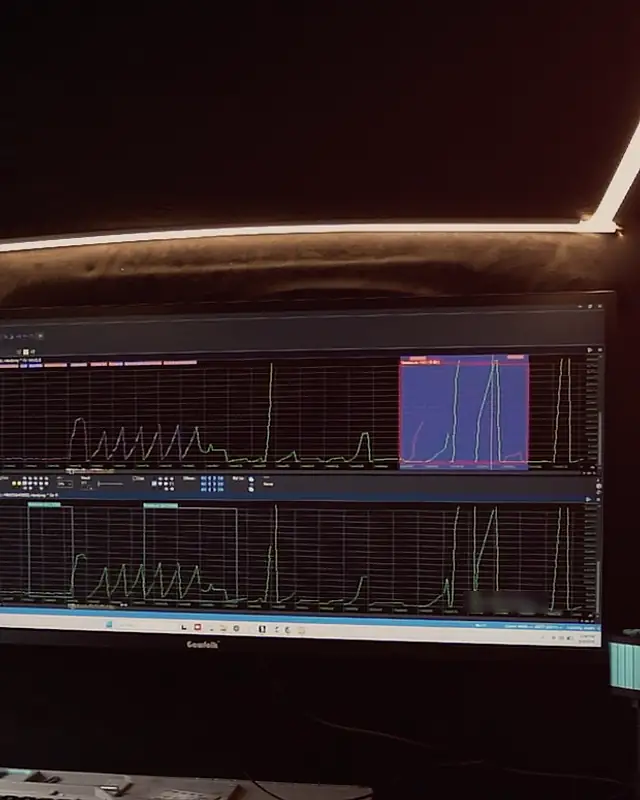 The Platinum Tune file desk at night: curves on the ultrawide monitor under the LED strip