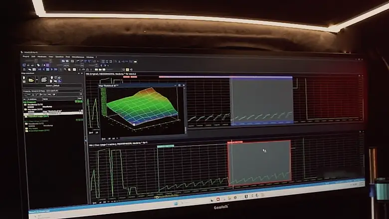 A 3D fuel map open in the tuning software on the ultrawide monitor, under the LED strip